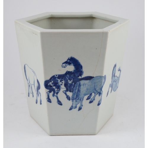 133 - A Chinese blue and white hexagonal jardiniere, Kangxi mark but 19th/20th century, painted with the e... 