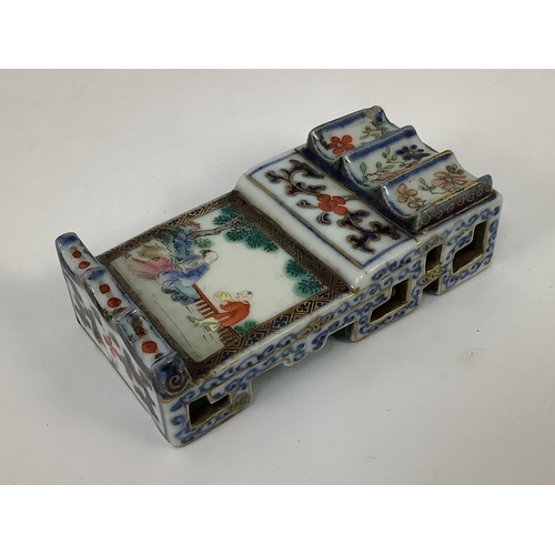 135 - A small Chinese enamelled porcelain brushrest, Jiaqing mark and period (1796-1820), finely painted w... 