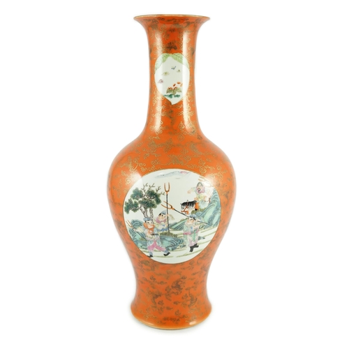 137 - A Chinese coral ground vase, Qianlong mark but early 20th century, painted to three circular medalli... 