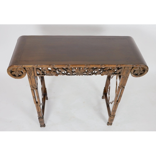 140 - A Chinese hardwood altar table, 20th century, the rectangular top with rounded ends, above a fruitin... 