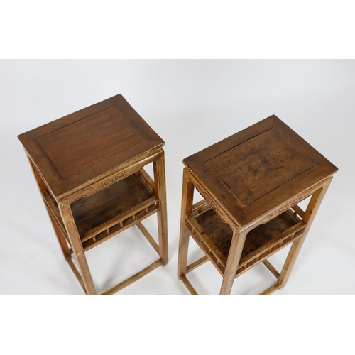 142 - A pair of Chinese elm incense stands, 19th century, the rectangular tops above a galleried central t... 