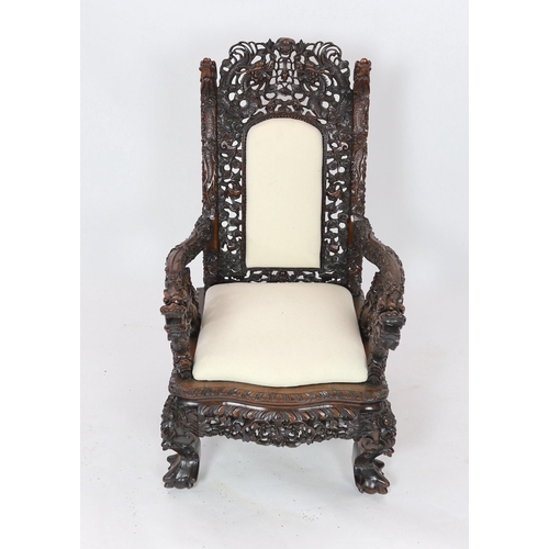 143 - A good Chinese hongmu dragon throne armchair, c.1900, carved in high relief and open work with con... 