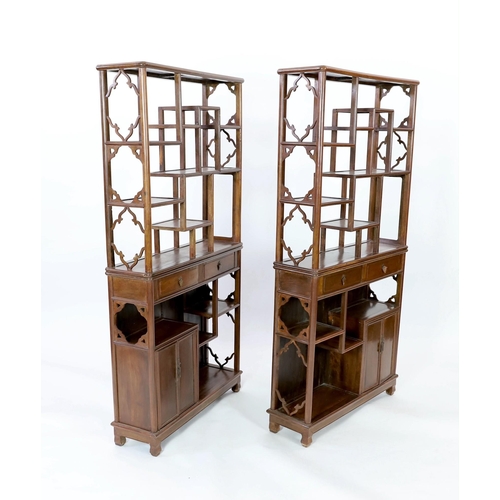 145 - A pair of Chinese jichimu display cabinets, each with asymmetrical open shelves above two drawers, f... 