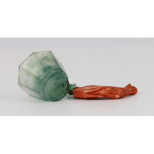 150 - A Chinese jadeite small cup and a coral 'fish' pendant, 19th/20th century, the octagonal cup with fl... 