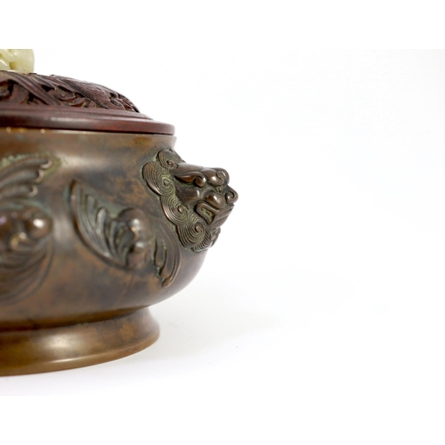 156 - A large Chinese bronze ding censer, the wood cover with pale celadon jade finial, the censer cast in... 