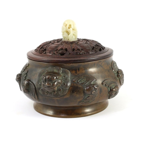 156 - A large Chinese bronze ding censer, the wood cover with pale celadon jade finial, the censer cast in... 