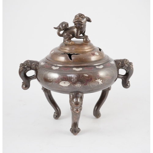 158 - A Vietnamese silver inlaid bronze tripod censer and cover, 19th century, inlaid in silver and copper... 