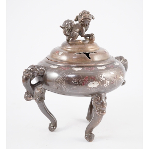 158 - A Vietnamese silver inlaid bronze tripod censer and cover, 19th century, inlaid in silver and copper... 