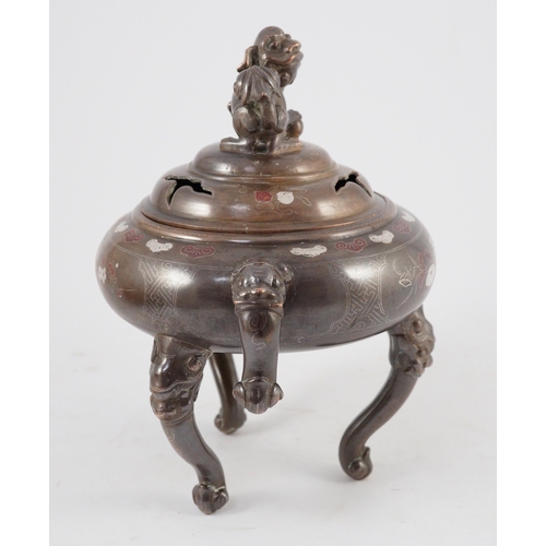 158 - A Vietnamese silver inlaid bronze tripod censer and cover, 19th century, inlaid in silver and copper... 