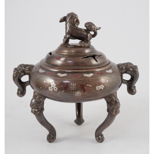 158 - A Vietnamese silver inlaid bronze tripod censer and cover, 19th century, inlaid in silver and copper... 