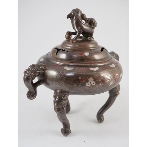 158 - A Vietnamese silver inlaid bronze tripod censer and cover, 19th century, inlaid in silver and copper... 