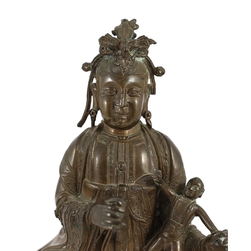 160 - A large Chinese bronze group of Xi Wangmu and a child, late Ming dynasty, three column inscription t... 