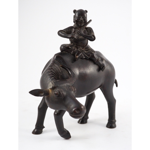 162 - A Chinese bronze boy riding a water buffalo censer, 17th/18th century, the figure of a boy playing... 