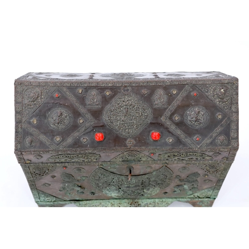 164 - A Tibetan copper repousse-work casket, 20th century, the arched cover and side panels decorated with... 