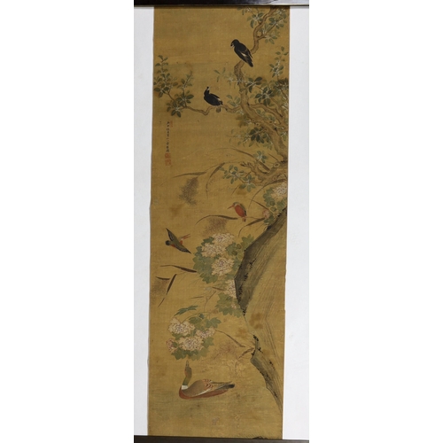 169 - A Chinese scroll painting on silk of birds, rockwork and plants overhanging a pond, 19th century, in... 