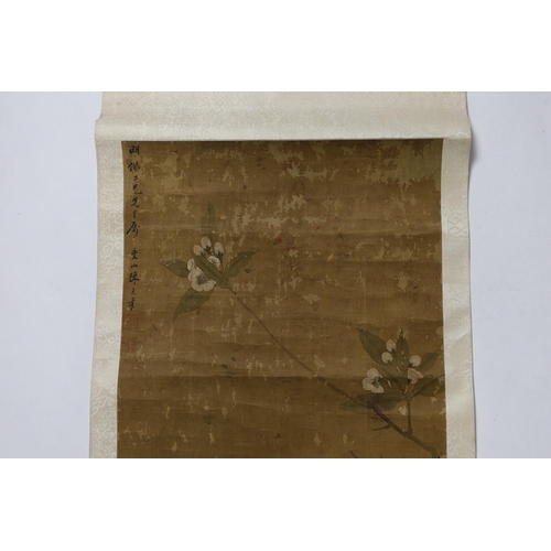 170 - A Chinese scroll painting on silk of blackbirds perched on a blossoming branch, 19th century, inscri... 