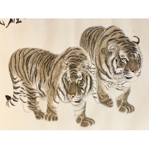 172 - Chinese School, early 21st century, scroll painting on paper of two tigers, inscribed upper left and... 