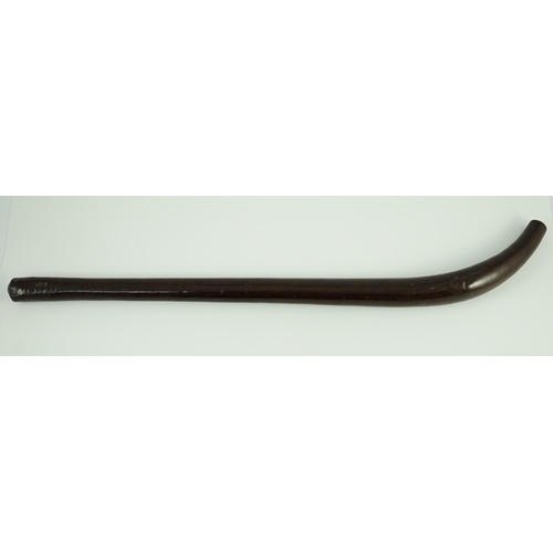 18 - A Fijian curved hardwood dancing club, of rounded tapered form, 62cm long