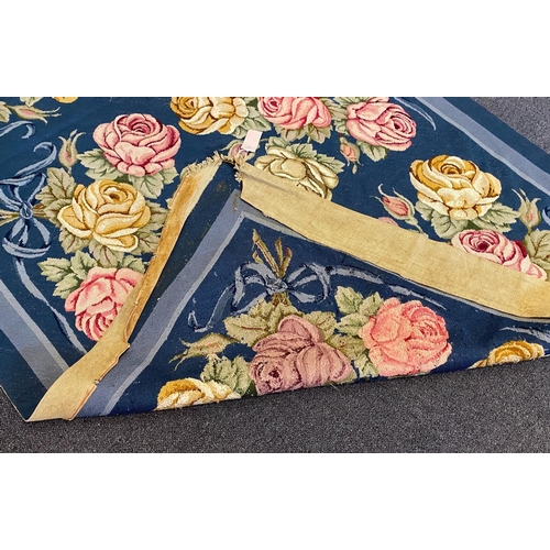 197 - An English needlepoint blue ground carpet, woven with polychrome rose bunches, initialled and dated ... 