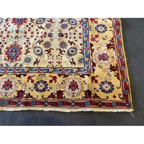 199 - An Agra ivory ground carpet, with stylised floral field within a wide conforming border, 360 x 274cm... 