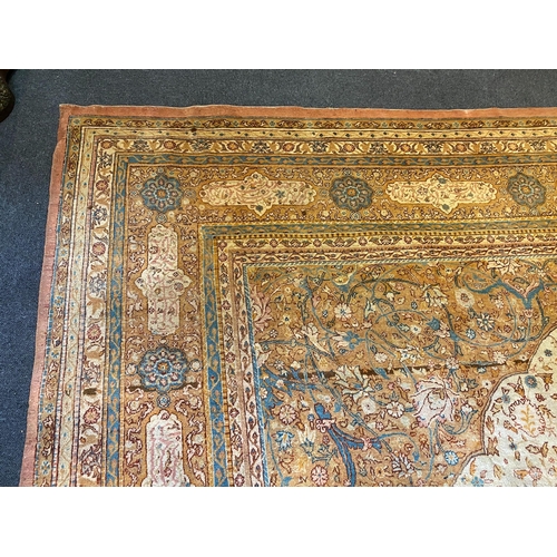 202 - An early 20th century Tabriz ivory ground carpet, with central lobed medallion and dense floral fiel... 