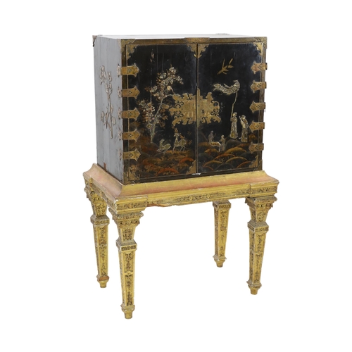 206 - A William & Mary black japanned cabinet on stand, the two door cabinet with original gilt brass moun... 