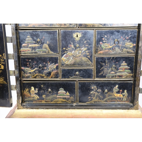 206 - A William & Mary black japanned cabinet on stand, the two door cabinet with original gilt brass moun... 