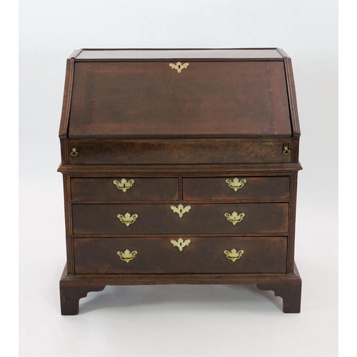 209 - An early 18th century burr walnut bureau, the fall enclosing a central cupboard door flanked by an a... 