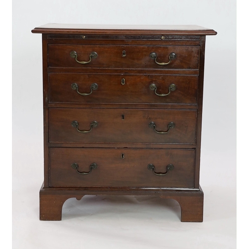 212 - A small George III mahogany chest, with brushing slide and four graduated long drawers on bracket fe... 