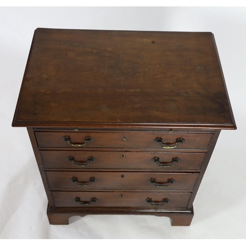 212 - A small George III mahogany chest, with brushing slide and four graduated long drawers on bracket fe... 