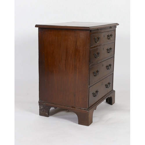 212 - A small George III mahogany chest, with brushing slide and four graduated long drawers on bracket fe... 