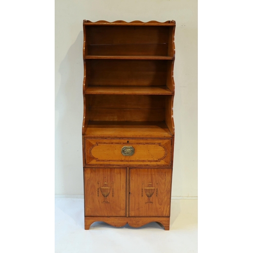 214 - A George III Sheraton style inlaid satinwood waterfall bookcase, with three open shelves over a deep... 