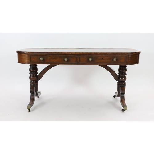 215 - A Regency mahogany library table, with rounded rectangular top, two long and two dummy drawers, on t... 