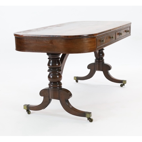 215 - A Regency mahogany library table, with rounded rectangular top, two long and two dummy drawers, on t... 