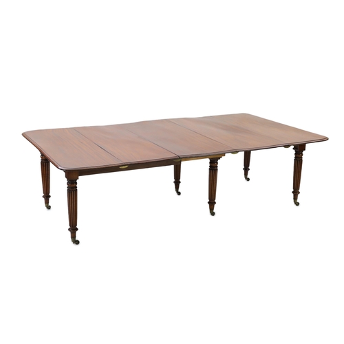 216 - A Regency mahogany extending dining table, with rounded rectangular top and four leaves, on six turn... 