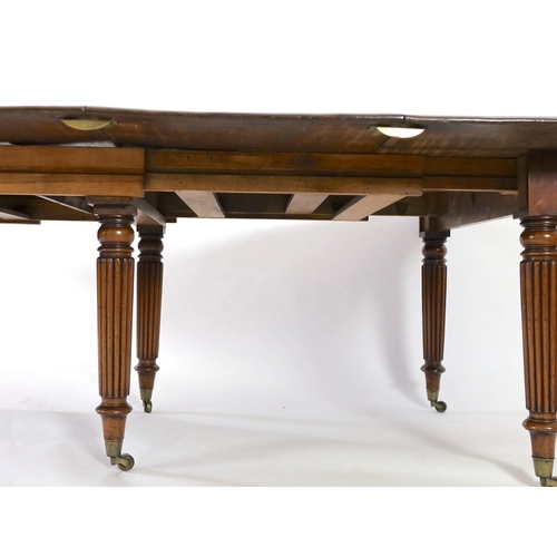 216 - A Regency mahogany extending dining table, with rounded rectangular top and four leaves, on six turn... 