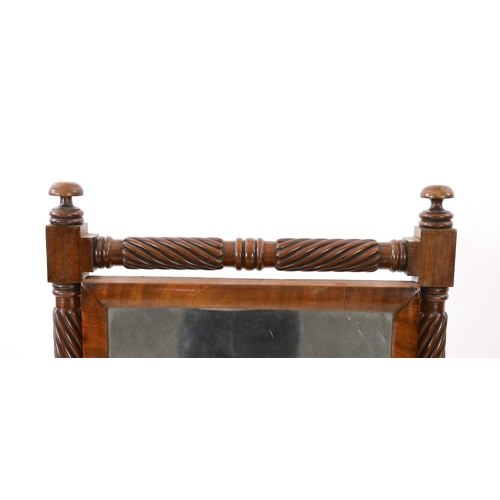 217 - A Regency mahogany cheval glass, with spiral fluted turned frame and moulded downswept legs fitted b... 