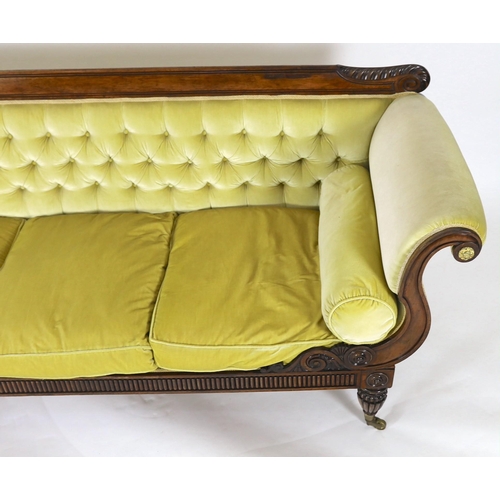 218 - A Regency rosewood settee, with acanthus carved cresting rail, brass paterae inset scroll arms and f... 