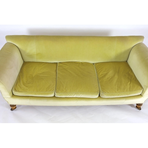 219 - A Victorian Howard & Sons oak settee, with scroll arms and turned legs, fitted brass castors, W.236c... 