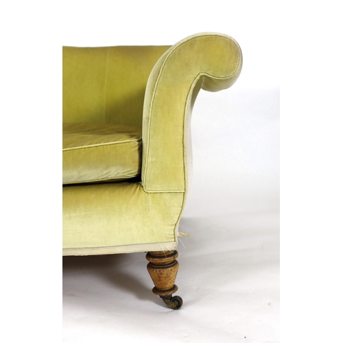 219 - A Victorian Howard & Sons oak settee, with scroll arms and turned legs, fitted brass castors, W.236c... 