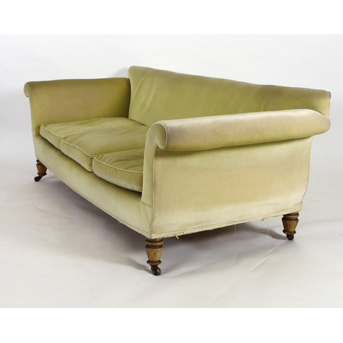 219 - A Victorian Howard & Sons oak settee, with scroll arms and turned legs, fitted brass castors, W.236c... 