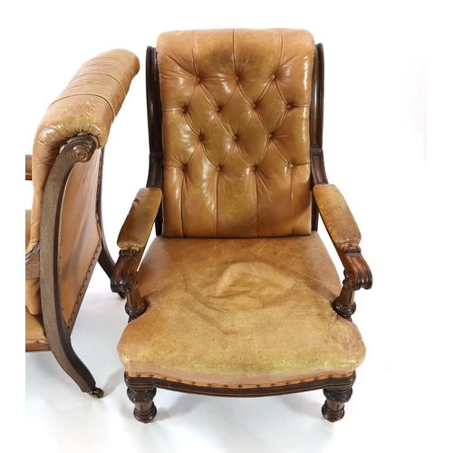 222 - A pair of early Victorian mahogany open armchairs, with moulded frames and brown leather upholstery,... 