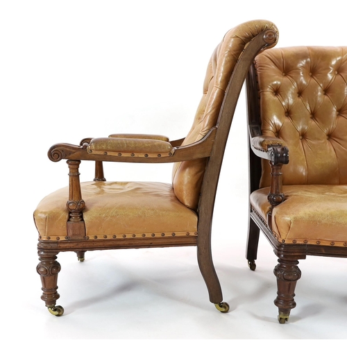 222 - A pair of early Victorian mahogany open armchairs, with moulded frames and brown leather upholstery,... 