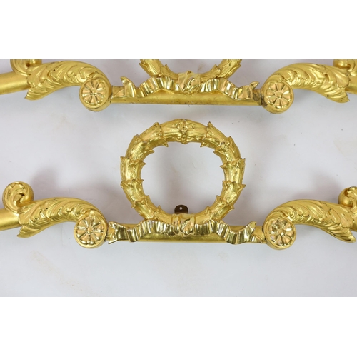 223 - A pair of mid 19th century giltwood pediments, of laurel wreath ribbon and scroll form with eagles h... 