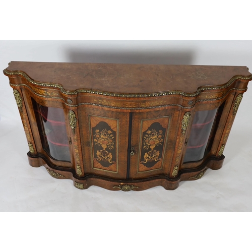 224 - A Victorian marquetry inlaid walnut serpentine front credenza, the two central doors inlaid with pan... 