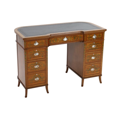 229 - An Edwardian painted satinwood kneehole desk, with concave front and bowed back and decorated in the... 