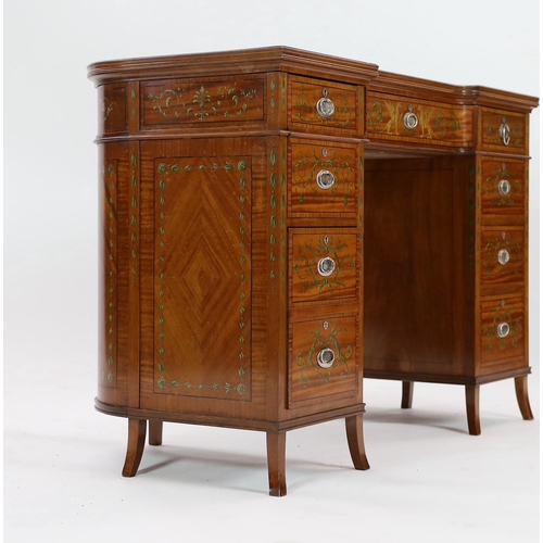 229 - An Edwardian painted satinwood kneehole desk, with concave front and bowed back and decorated in the... 