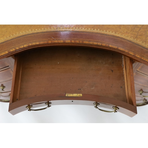 230 - An Edwardian satinwood banded mahogany kidney shaped kneehole desk, with brown skiver and arrangemen... 