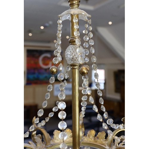 231 -  A late Victorian ormolu and cut glass light fitting, by F & C Osler, with glass swagged stem, scrol... 