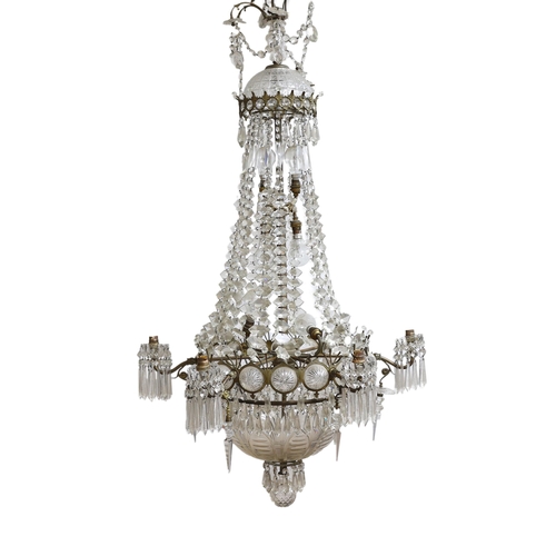 232 - An Edwardian cut glass chandelier, with swagged top and lozenge shaped drops sweeping down to the ma... 